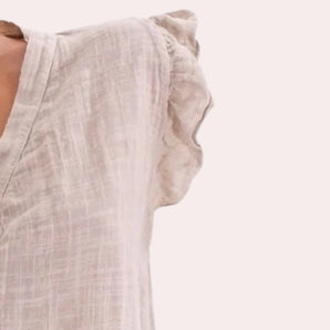 Linen blouse in a light grey color, featuring a sleeveless design with a breathable fabric, suitable for summer wear.