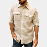 Linen shirt for men in white, featuring a casual lightweight design, relaxed fit, with long sleeves, a collar, and a button-up style, shown in a khaki color and size 3XL. The model has a beard and is making a gesture with his arm.