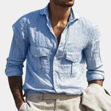 Men's white linen shirt with a casual style, featuring a relaxed fit, a classic collar, and long sleeves.