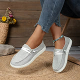 Gray linen women's sneakers in size 43, eco-friendly design with breathable material, shown on a person wearing casual attire.