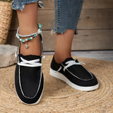 Eco-friendly beige linen women's sneakers in Nero color, size 43, shown being worn with denim.