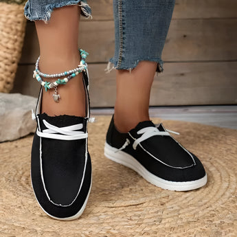 Eco-friendly beige linen women's sneakers in Nero color, size 43, shown being worn with denim.
