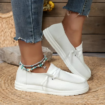 White linen women's sneakers in size 43, designed as eco-friendly and breathable casual shoes.
