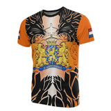Orange t-shirt featuring a heraldic lion graphic with crossed swords, worn by a person.