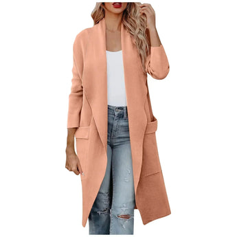 
A woman wearing a rose-colored long camel coat with a waterfall open front design, showcasing a stylish autumn jacket. The coat features a collar, long sleeves, and a defined waist, suitable for a 2XL size. The woman is accessorized with a grey bag.