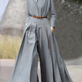 Grey pleated maxi dress with a belted waist, collared neckline, and long sleeves, designed for an urban chic look, shown in size XL.