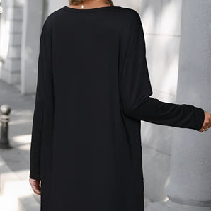 Long sleeve black dress with pockets, featuring a lightweight and casual design.