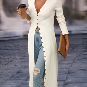 Long white button-front V-neck ribbed knit cardigan with long sleeves, displayed on a fashion model.