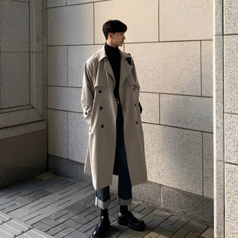 A long white men's double-breasted winter coat with stylish urban fashion, featuring a frock coat design, collar, and matching grey accents.