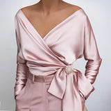 Luxurious pink satin silk wrap blouse with a deep V-neck and jeweled belt, shown in size 2XL.