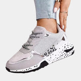Luxurious women's designer sneakers in a white and gray animal print design with metallic accents, styled for outdoor walking and sportswear, in size 42.
