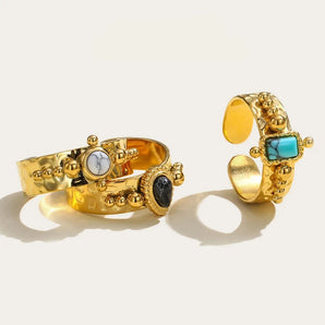 Luxury 18K gold plated ring for women with vintage gemstone, featuring amber-like design and intricate detailing, placed against a neutral background.