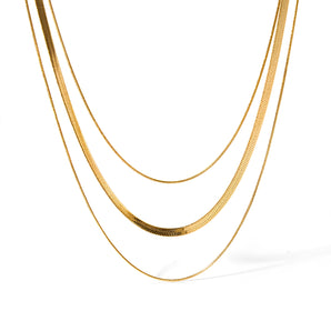 Luxury 18K gold plated snake chain necklace, sleek and elegant design, shown on a white background.