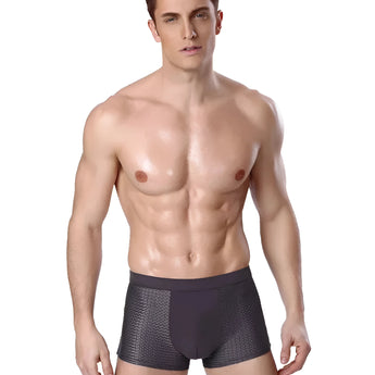 A man wearing luxury bamboo boxer briefs, showing breathable and moisture-wicking fabric in a multi-pack.