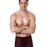 A fit male model wearing luxury bamboo men's boxer briefs showcasing a breathable, moisture-wicking fabric.