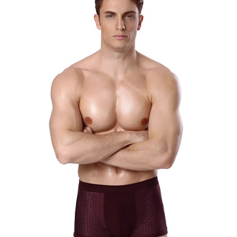 A fit male model wearing luxury bamboo men's boxer briefs showcasing a breathable, moisture-wicking fabric.