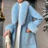 Luxury beige winter coat featuring a light blue color in a large size, with a stylish faux fur collar and designer wool fabric, showcasing long sleeves and a fitted waist for a fashionable look.