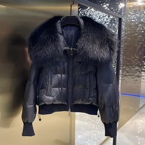 Luxury black puffer jacket with a prominent fur collar, featuring long sleeves and a sleek designer fashion look.