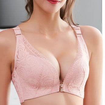 Luxury black lace bralette featuring floral embroidery, wire-free design, and adjustable straps displayed against a white background.