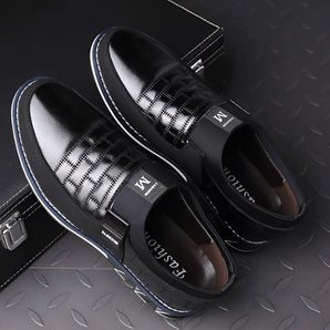 Luxury black leather men's formal shoes with a designer checkered pattern, showcasing sleek craftsmanship and elegant design.