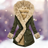 Luxury green women's parka in 3XL with a fur-lined hood, featuring a stylish design. The jacket includes long sleeves, a fitted waist, and a high collar, perfect for winter wear. A hand is shown adjusting the collar, highlighting the jacket's elegant texture and craftsmanship.