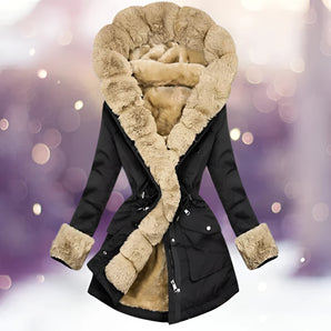 Luxury black women's parka with fur hood, showcasing detailed design elements such as the structured shoulders, tailored waist, and long sleeves. The model is wearing the jacket, highlighting its elegant drape and high-quality textile.