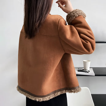 Luxury brown suede jacket with a plush shearling collar, showcasing the shoulder, neck, sleeve, and waist areas, emphasizing comfort and winter fashion style.