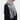 Gray luxury cashmere scarf with fringe detailing, elegantly wrapped around the shoulders, showcasing a sophisticated winter fashion accessory.