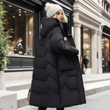 Oversized black puffer down jacket with a fur hood, featuring a fashionable design, standing display, and long sleeves.