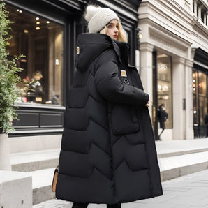 Oversized black puffer down jacket with a fur hood, featuring a fashionable design, standing display, and long sleeves.
