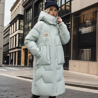 Oversized light green luxury designer down jacket with a fur-trimmed hood, displayed in a 3XL size, featuring long sleeves and a puffer style.