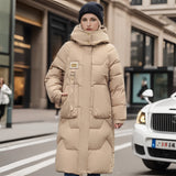 Oversized black puffer down jacket with fur hood in khaki color, displayed on a mannequin, styled with an open front showcasing its luxurious design.