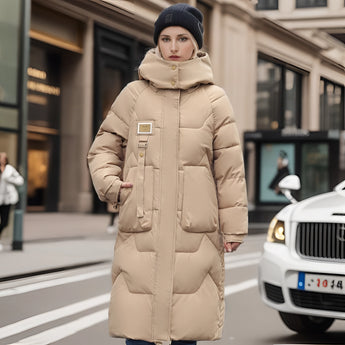 Oversized black puffer down jacket with fur hood in khaki color, displayed on a mannequin, styled with an open front showcasing its luxurious design.