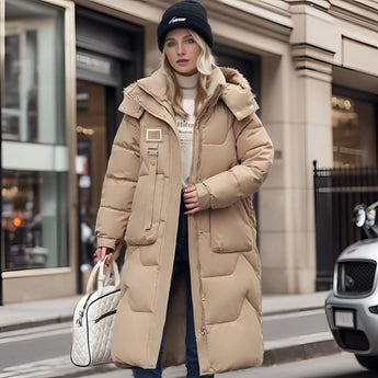Oversized black puffer jacket with a fur-lined hood, showcasing a luxurious and fashionable design, featuring long sleeves and a comfortable waist fit.