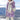 Luxury designer striped fur winter coat in Northern Violet color, featuring a mix of purple and white fur with pink accents. The coat includes long sleeves, a collar, and pockets, designed for a comfortable fit in 3XL size.
