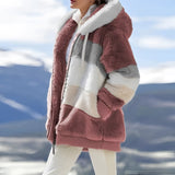 Luxury designer striped fur winter coat in a striking Arctic Pink color; features include a spacious 3XL fit, white and tartan pattern accents, and practical pockets. The coat has long sleeves and a high neck, styled for comfortable wear while standing.