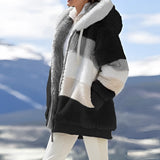 Luxury designer striped fur winter coat in Noors Zwart, featuring a 3XL size with an elegant pattern. The coat has a high neck, long sleeves, and deep pockets, reaching knee-length for optimal warmth. Suitable for cold weather, offering a sophisticated and stylish look.