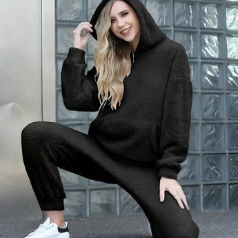 Luxurious black fleece loungewear set in 2XL, featuring a plush teddy design. The outfit is a coordinated set, consisting of a soft, cozy top and matching bottoms, ideal for lounging in style.