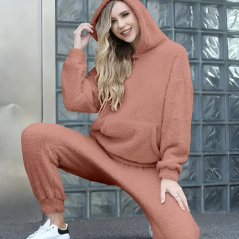 Luxury fleece loungewear set in plush beige with a teddy texture, featuring a co-ord outfit styled in an orange-brown color suitable for size 2XL. The model is smiling, showcasing the outfit's comfortable and fashionable outerwear design.