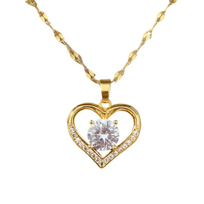 Luxury gold heart pendant necklace adorned with diamond crystal charm on a delicate chain, perfect for a romantic gift.