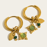 Luxury gold hoop earrings with pearl charms from YA-CHAN Designer Jewelry, model YC0476, featuring circular gold hoops adorned with delicate pearl accents.