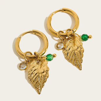 Luxury gold hoop earrings with pearl charms and green bead and crystal embellishments, designed by YA-CHAN.