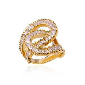 Luxury gold infinity ring with diamond pavé in an elegant crossover design, resembling a snake with intricate scales and artistic craftsmanship.