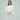 Luxury gray cashmere poncho for women, featuring an elegant designer knitwear style with a soft drape over the shoulders and a refined neckline, shown in an ivory color for a sophisticated fashion statement.