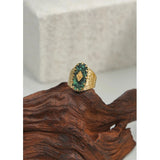 Luxury green gemstone ring with textured 18K gold band featuring a rectangular emerald by YA-CHAN.