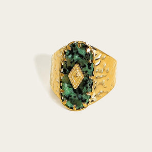 Luxury Green Malachite gemstone ring with a textured 18K gold band, featuring a rectangular green gemstone set intricately on the band.