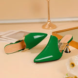 Luxury green mules featuring a sleek metallic heel, showcasing a chic designer slip-on style perfect for fashion-forward wardrobes.