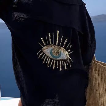 Luxury green silk blouse featuring a sequin eye embellishment, shown in Nero color variant in size 3XL. The blouse has a sleek design with a focus on the neckline and long sleeves.