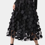 Luxury high-waist black skirt featuring intricate 3D floral patterns, designed for women seeking a stylish and artistic fashion statement.