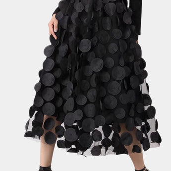 Luxury high-waist black skirt featuring intricate 3D floral patterns, designed for women seeking a stylish and artistic fashion statement.